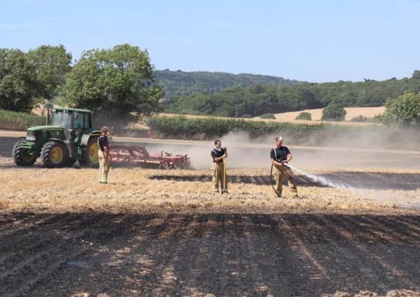 Photo by WSFRS. Firefighters at a crop fire in Chilgrove Road, Lavant. 23-07-18