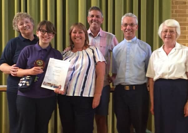 3rd Southwick Girls' Brigade captain Yvonne Yates, Georgie Lock with her parents Karen and Terry Lock, Southwick Methodist Church minister the Rev Ian Suttie and Margaret Taylor, district commissioner for the South Downs district of the Girls' Brigade