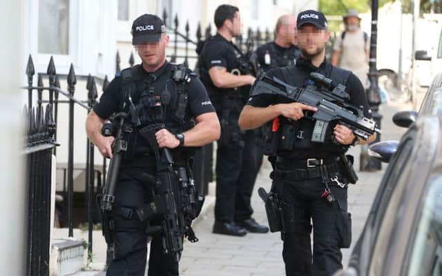 Armed officers in Hove (Photograph: Eddie Mitchell)