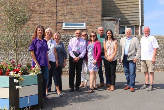 Councillors and traders by the renovated planters in Lancing