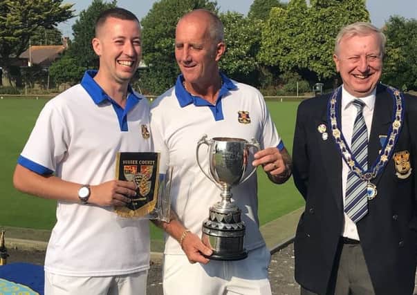Sidley Martlets Bowls Club duo Michael Stone (left) and Carl Dyer receive their prizes after winning the Sussex men's pairs title alongside Sussex County Bowls men's section president 2018 John Kinnard.