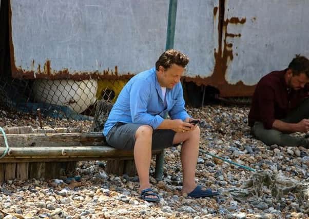 Jamie Oliver, pictured at West Beach, Littlehampton, while filming for an episode of Jamie and Jimmys Friday Night Feast. Picture: Steve McKay/Inspire'd Flights