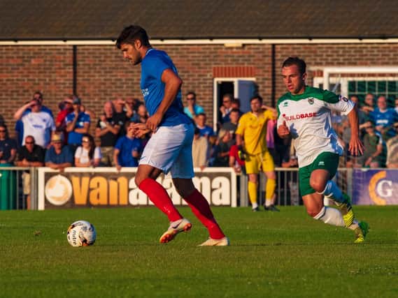 Gareth Evans in possession, watched by Calvin Davies / Picture by Tommy McMillan