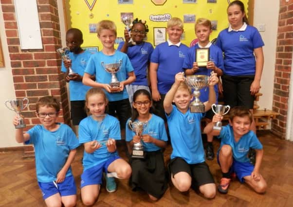 Children celebrated after receiving the Kitemark gold standard sports awards