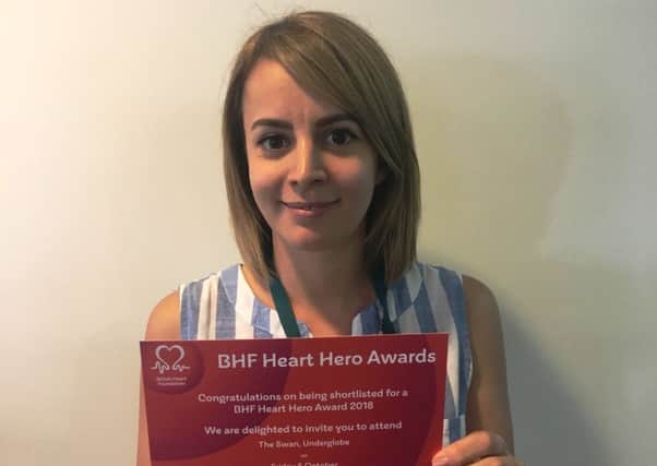 Michaela Wheatley with her invitation to the British Heart Foundation Heart Hero Awards