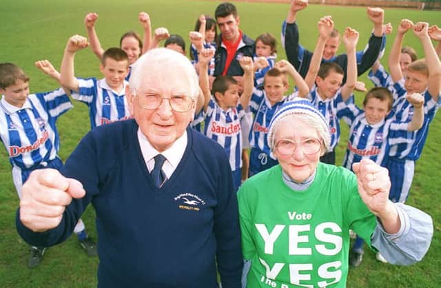 Albion supporters Ted and Mary Emery with junior Seagulls at Wihdean Stadium 47104-34