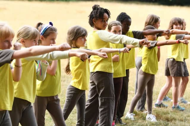 Brownies having a go at a boxing activity. Picture:  Doug Peters/PA Wire
