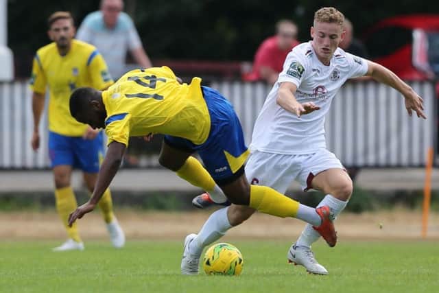 Lovatt in the thick of the action against Kingstonian on Saturday. Picture courtesy Scott White