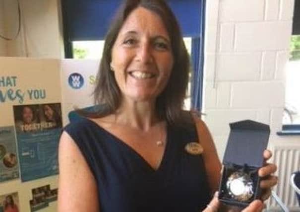 Sharon Ashborn with her award