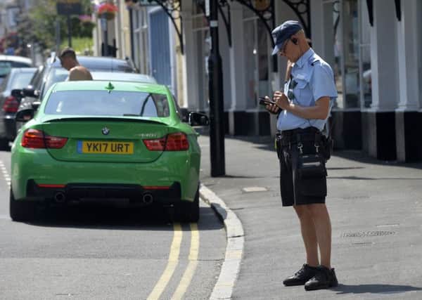 Traffic Warden in Eastbourne (Photo by Jon Rigby) SUS-180726-093139008