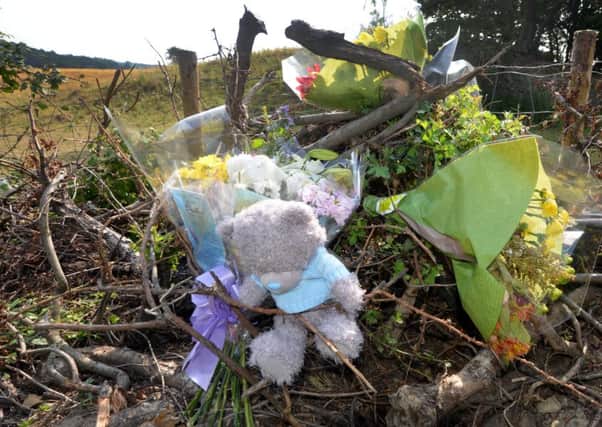 Tributes left at the scene of a fatal crash on the A28, Brede Hill