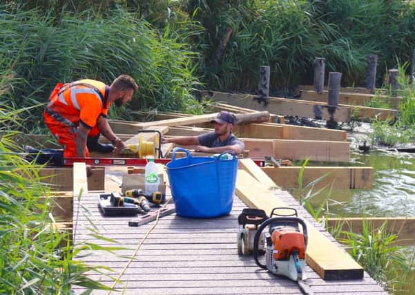Work to install the new boardwalk at the Brooklands Pleasure Park lake in East Worthing