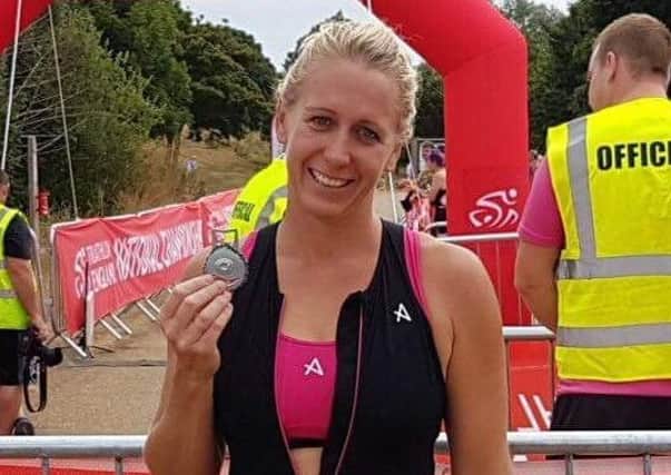 Gail Wright clutches her medal at the British Triathlon National Aquathlon Championships.
