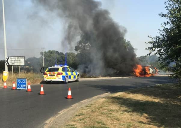 A car is on fire at the Boship roundabout in Eastbourne. Picture: Shal Miah