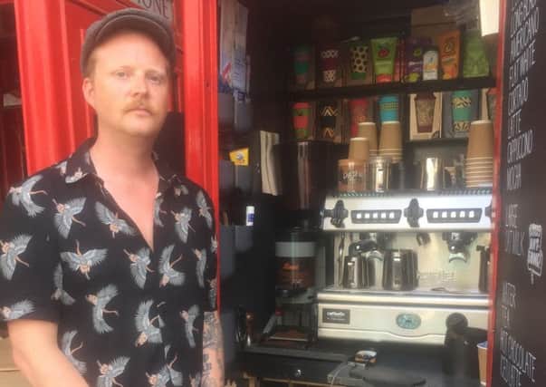 Greg Ackerley at his Dialling In coffee shop in New Road, Brighton
