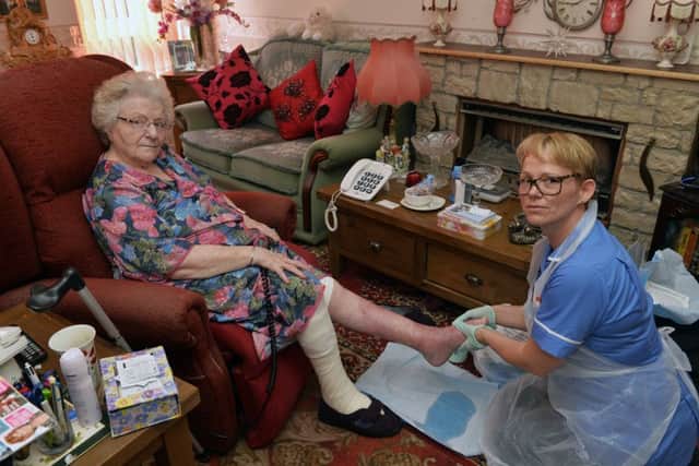 Priscilla Brown at her home in Eastbourne being treated by Community Nurse Daniela  (Photo by Jon Rigby)