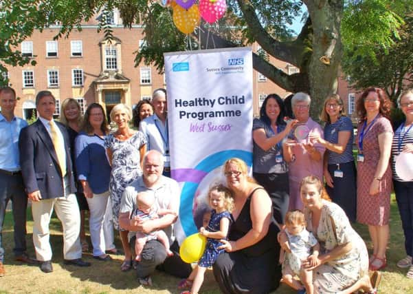 Parents using Family Assist join County Council and NHS staff for the birthday celebrations outside County Hall in Chichester