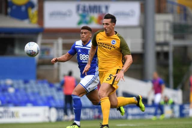 Lewis Dunk is closed down by Che Adams. Picture by PW Sporting Photography