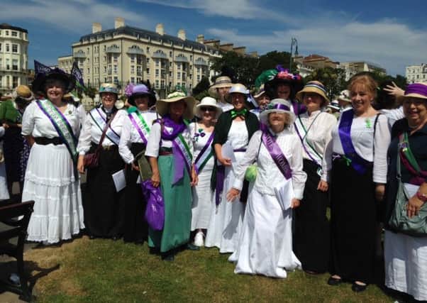 Harmony One choir dressed as suffragettes SUS-180716-091638001