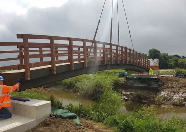 The new bridge lifted into position