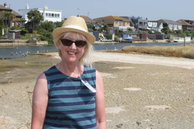 Secretary Jo Procter at the lagoon where dry areas are still visible