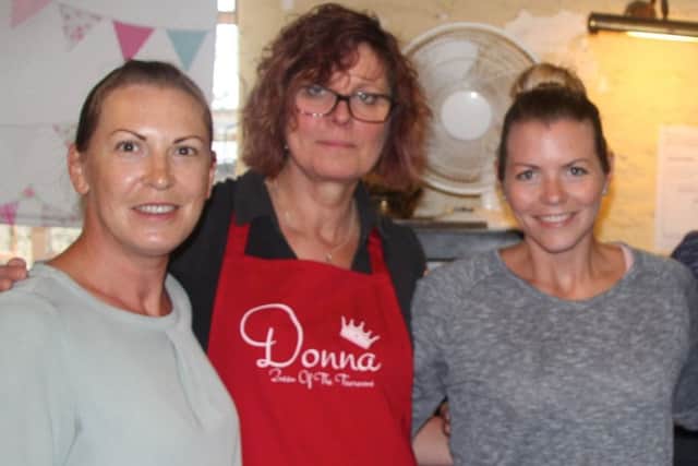 Donna Lewington (centre) with two members of her original team, Kate Maksimova (left) and Ellie Day SUS-180108-105728001