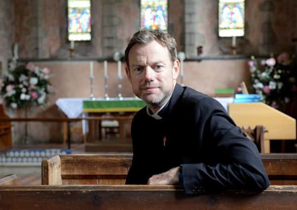 Father Martin Powell said there was a 'sense of outrage' following the break-ins. Picture: Kate Shemilt