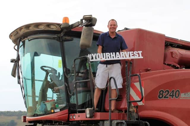 Arundel and South Downs MP Nick Herbert on a combine harvester to support the #YourHarvest campaign