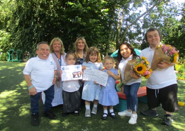 Warwick Davis, his daughter Anabelle Davis and Simeon Dyer from the charity Little People UK visited Springfield Infant school
