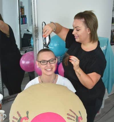 Hannah's head shave, which was a big deal for her as she did not lose her hair through treament. Picture: Trevor England