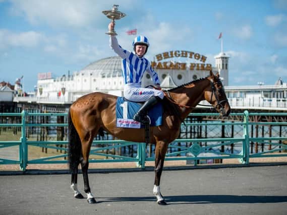 Brighton jockey Joshua Moore pictured in front of Brighton Palace Pier. Picture by Brighton Racecourse