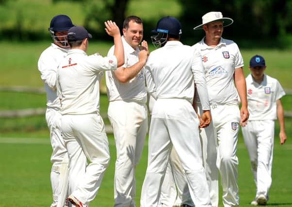 Bexhill celebrate a wicket during the reverse fixture against tomorrow's opponents Billingshurst. Picture by Steve Robards