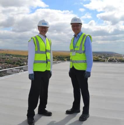 On the helipad at Royal Sussex County Hospital Brighton, Patrick Boyle (Interim Chair of BSUH) and Duane Passman, 3Ts Director