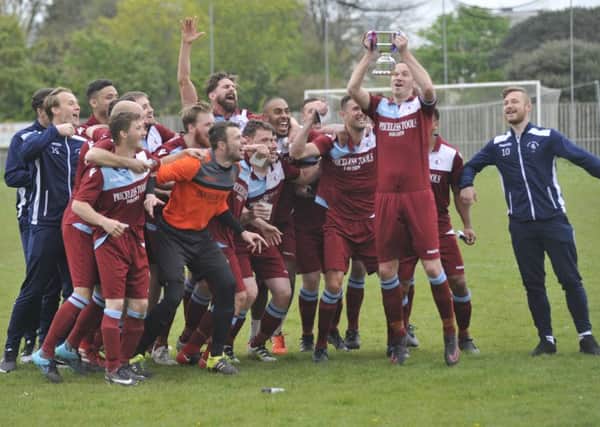 Little Common Football Club celebrates with the Southern Combination League Division One trophy at the end of last season. Picture by Simon Newstead