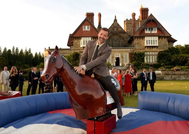 Patrick Grant tried his luck on the bucking bronco on the croquet lawn