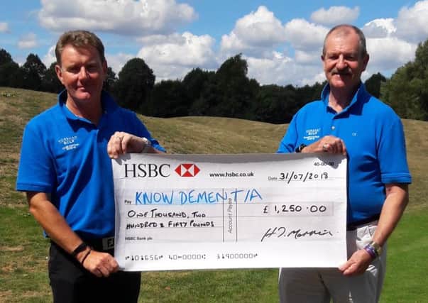 Horsham Golf club captain Howard Mannion and seniors captain Alex Morrison-Cowan with a cheque for Know Dementia