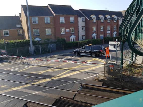 Network Rail technicians are at the closed crossing. Photo by Michael Drummond