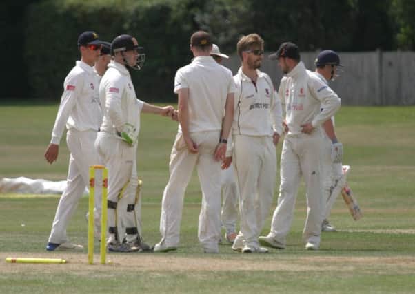 Will Beer celebrates his second wicket for Horsham against Hastings. Photo by Clive Turner