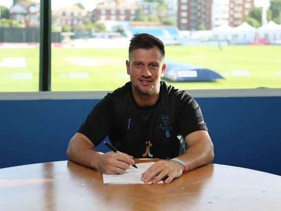 Harry Finch signs his new Sussex deal / Picture by Sussex Cricket