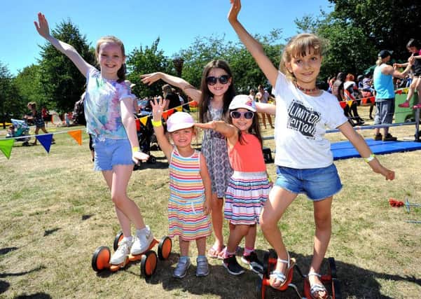 Youngsters having fun in the sun in St John's Park in Burgess Hill. Picture: Steve Robards