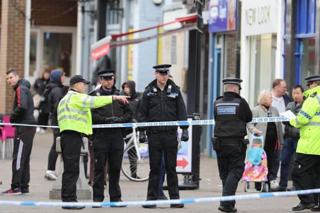 The stabbings took place in Terminus Road, Littlehampton