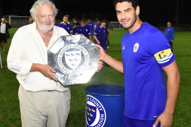 Naim Rouane receives the trophy. Haywards Heath Town v Albion u23s. Sussex Community Shield. Picture by Grahame Lehkyj