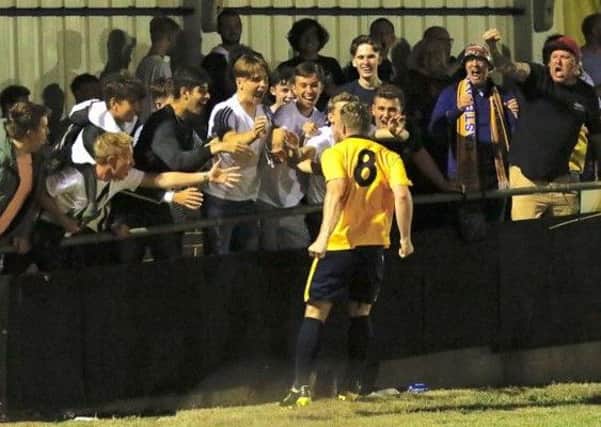 Eastbourne Town celebrate their victory against Langney at the Saffrons