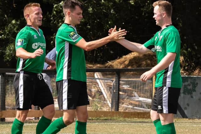 Pat Harding, Charlie Bennett and Ben Pope celebrate a goal pre-season. Picture by Chris Neal