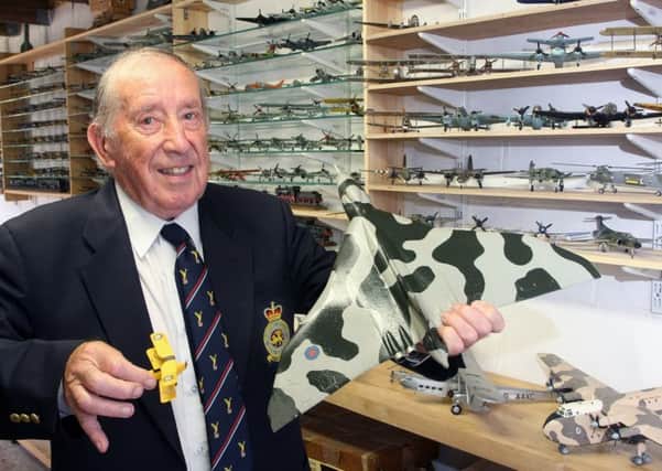 Cliff White with some of his 270 model planes