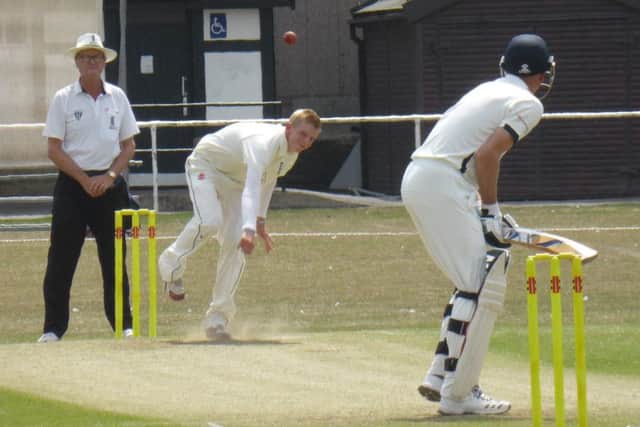 Byron Smith bowling for Bexhill.