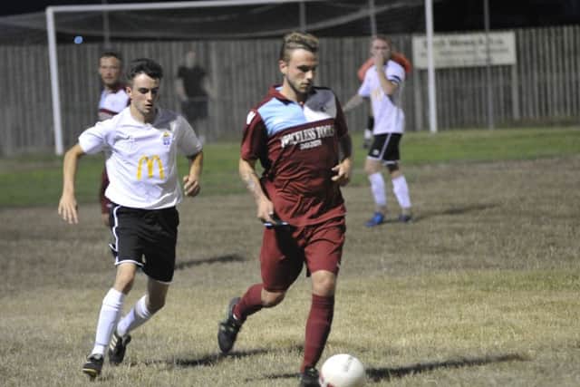 Harry Saville in possession against Eastbourne United AFC.