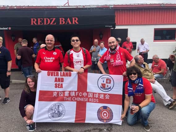 our Chinese Super fan Sam outside Redz Bar, complete with his Crawley Town flag mixing with fellow Reds fans before the Stevenage game. From left to right, Vicky, Steve, Sam, Matt and Adam.