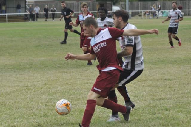 Adam Smith tussles for possession during the FA Cup extra preliminary round tie.