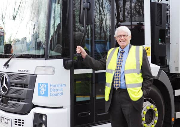 Horsham district councillor Philip Circus with one of the district's new waste trucks pictured earlier this year SUS-180502-143216001